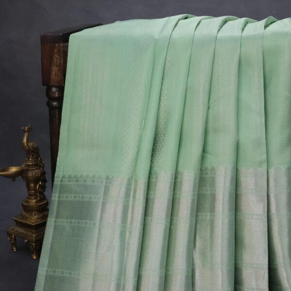 Pure kanchipuram silk saree pastel green and pastel brown with allover silver zari weaves and long silver zari woven border